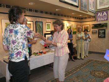 Nathelle accepting second place award for "The Vineyard at Willamette Valley"
